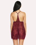 Wine red lace babydoll lingerie back view with crisscross straps and scalloped hem.