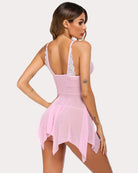 Pink lace front night dress with racer-back straps, lace trim, and asymmetric sheer hem.