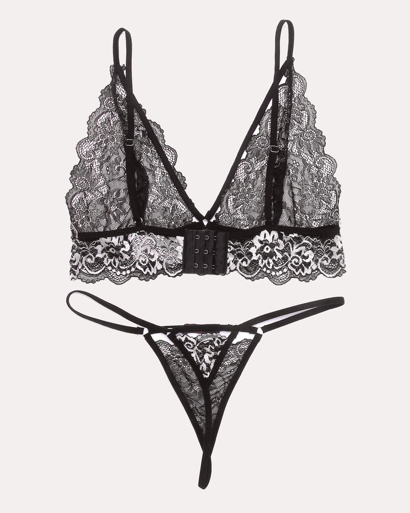 Lace V-neck bra and thong panty set, black lace with white floral trim, front view