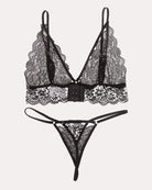 Lace V-neck bra and thong panty set, black lace with white floral trim, front view