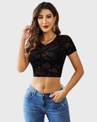 Black geometric patterned sheer mesh crop top, short sleeves and round neckline.
