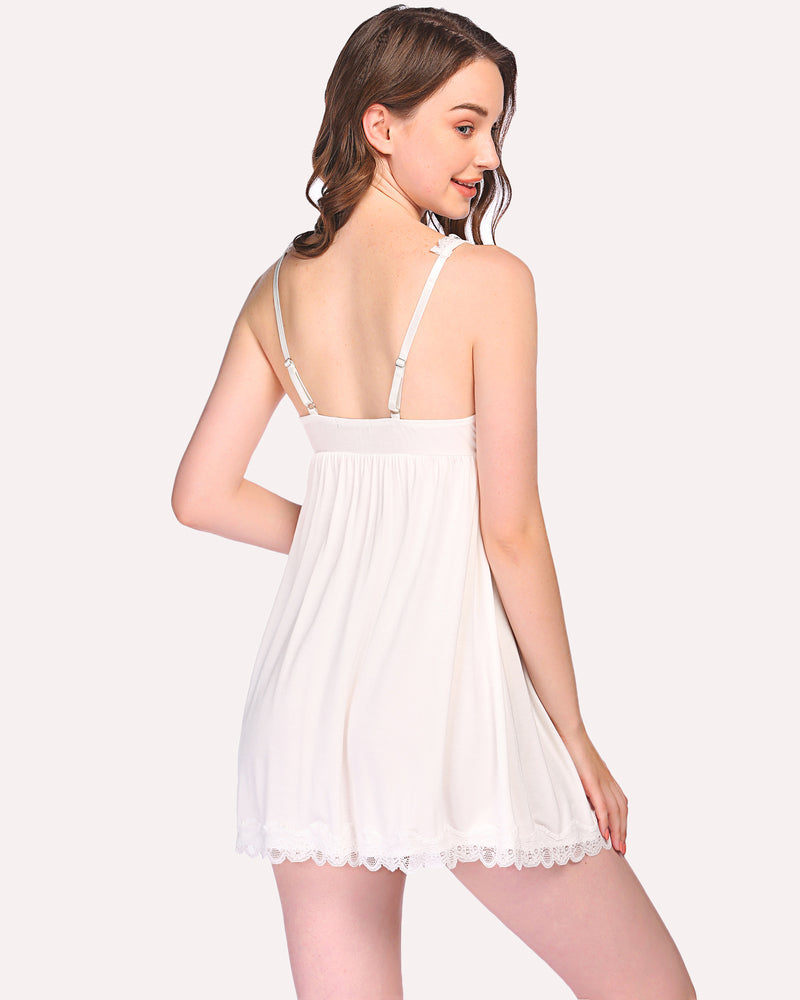 White chemise slip dress back view with lace straps and scalloped hem.
