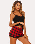 Black lace-trim cami pajama set with red plaid shorts and lace hem