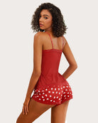 Red cami pajama set with lace trim and heart-print shorts
