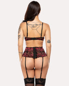 Red lace lingerie set with bra, garter straps, and lace garter panty detail