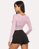 Pink sheer mesh crop top with long sleeves and smooth back design