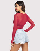 Red sheer mesh crop top with long sleeves, back view, round neckline