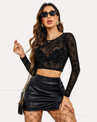Black floral-pattern mesh crop top with long sleeves and round neckline