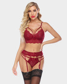 Lace bra and panty set with garter straps, burgundy lace with black thigh-high garter cuffs.