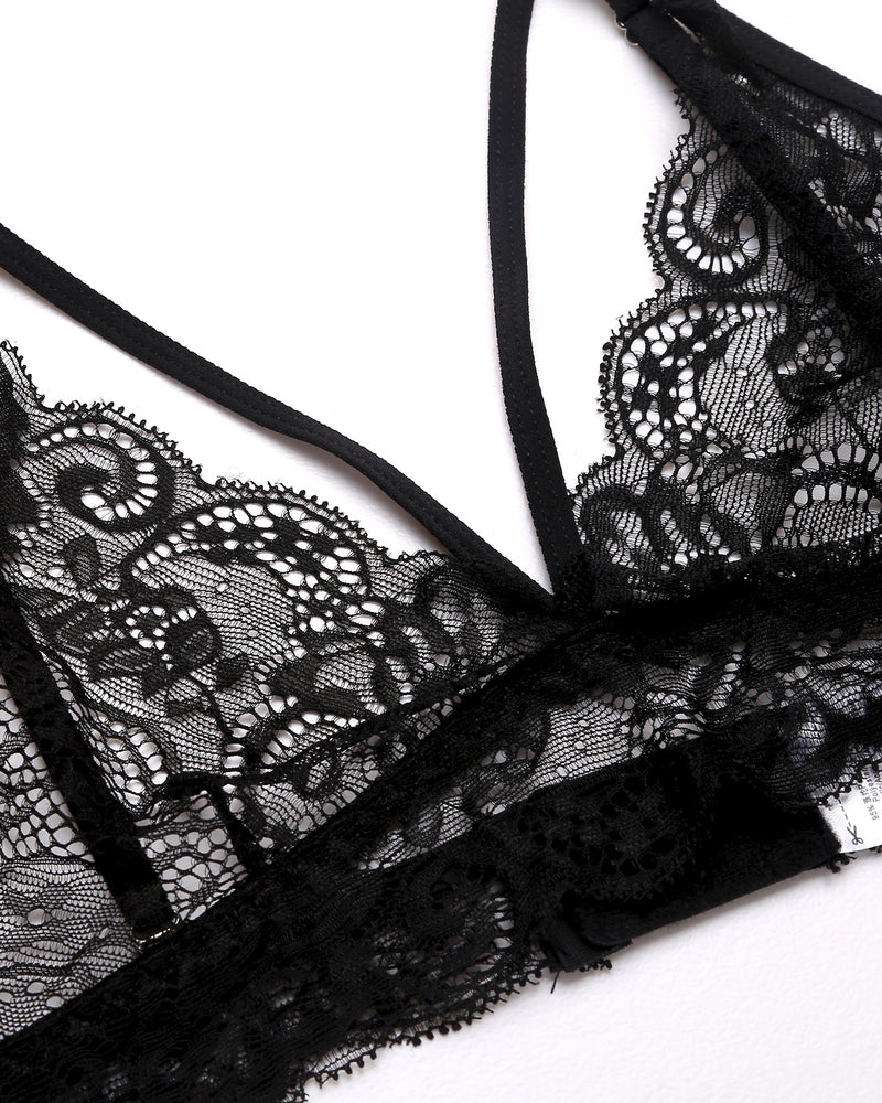 Black lace bralette detail with scalloped edges and thin straps