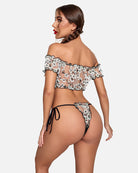 Lace ruffle bra and panty set, back view of black sheer floral print with tie side briefs