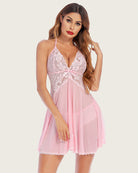 Pink lace babydoll dress with floral lace bodice, sheer flared skirt