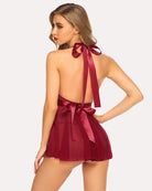 Burgundy lace halter babydoll with open back, ribbon bows and pleated sheer mini skirt