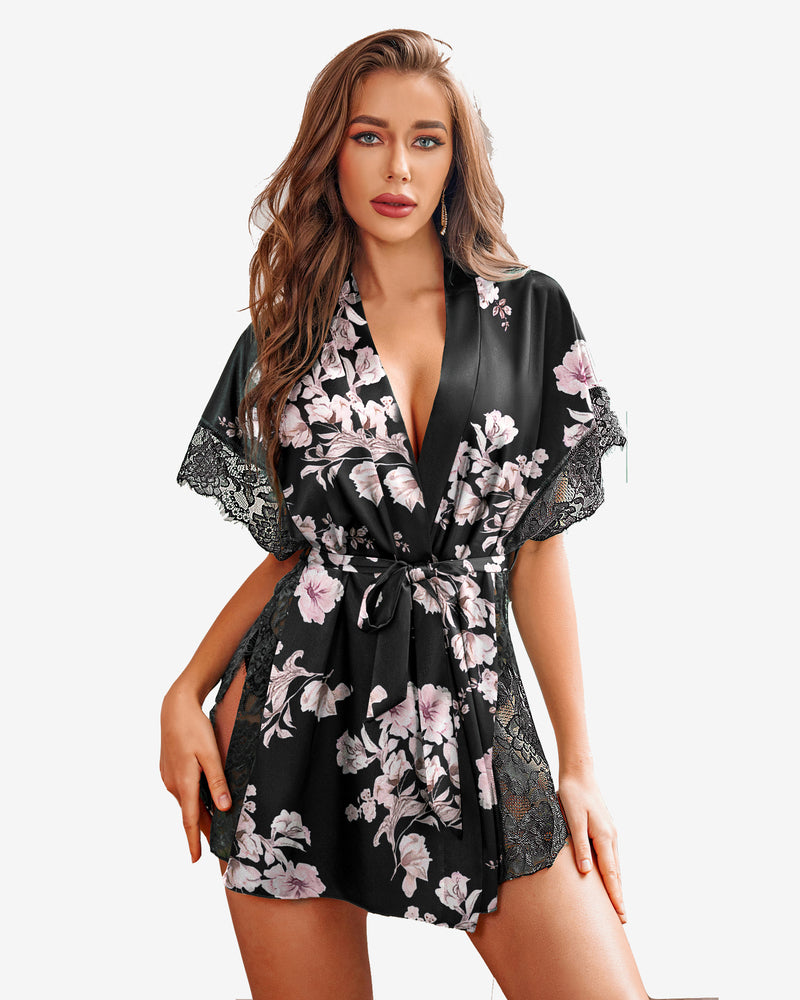 Black satin sleep robe with pink floral print, lace-trimmed sleeves, and tied waist belt.