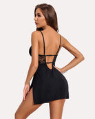 Black lace chemise with open back cutout, crisscross straps, and side slit