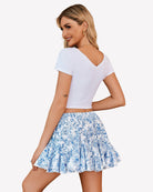 Blue floral skater skirt with elastic waistband and gathered pleats, ruffle hem
