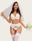 White lace bridal lingerie set with bra, panty, garter belt, and veil accessory