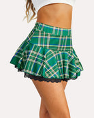 Green plaid ruffle mini skirt with pleats and black lace hem