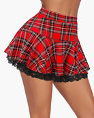 Pleated mini skirt in red tartan plaid with black lace-trim hem and ruffles