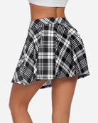 High-waist A-line plaid skirt in black and white, gathered waist and pleats