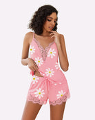 Pink floral pajama set with lace-trim camisole and matching lace-edged drawstring shorts