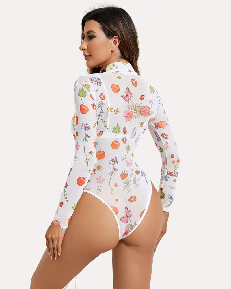 Turtleneck sheer mesh bodysuit in white with colorful fruit and flower print, long sleeves.