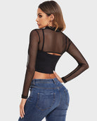Mock neck long sleeve crop top back view; sheer black long sleeves over black