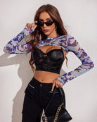 Purple and tan camouflage mock neck long sleeve crop top, front view.