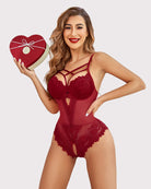 Red lace one-piece bodysuit with crisscross straps and lace cutout at leg