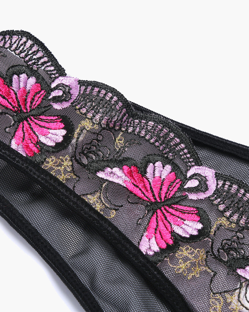 Embroidered mesh panties detail with pink flower motif and decorative stitching