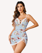 Light blue lace slip dress with floral print, crisscross neckline, and lace-trim side slit