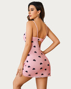 Pink heart print lace slip dress with open back and crisscross strap detail