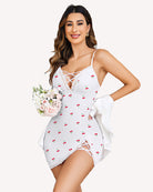 White lace slip dress with cherry print, lace-up front and scalloped trim