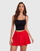 Red drawstring high-waist pleated mini skirt with ruched waistband and flared silhouette