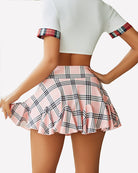 High-waist pleated ruffle skirt in light pink plaid with gathered hem