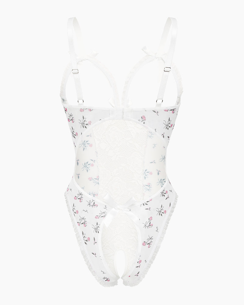 White lace mini bodysuit with pastel floral accents and bow shoulder straps