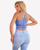 Blue V-neck racerback crop top with crisscross back straps and ribbed knit hem