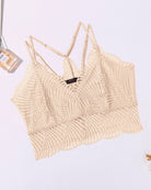 Beige lace V-neck racerback crop top with scalloped edges and thin straps, close-up
