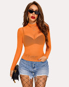 Orange long sleeve mock neck mesh crop top, sheer neckline and fitted long sleeves.