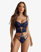 Navy lace bra and panty lingerie set with mesh mini skirt, featuring strappy center design