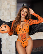 Orange Halloween rave bodysuit crop top set with long sleeves, printed pumpkins, and waist cutouts