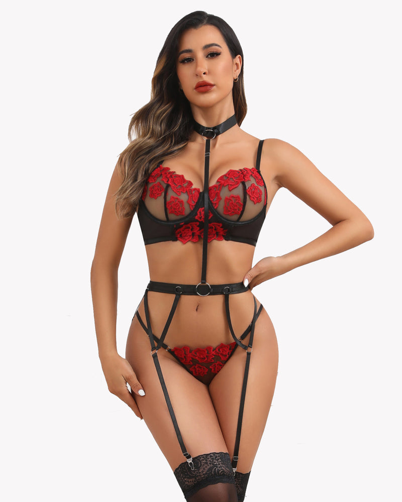 Black embroidered lace bra and panty set with red floral applique and garter straps