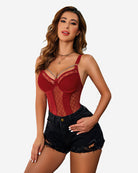 Red mesh bodysuit with push-up cups, chain garters, and waist ring over denim shorts