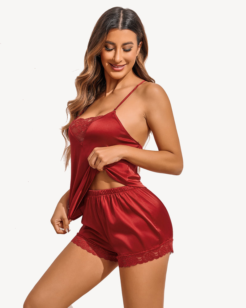 Dark red satin pajama set with lace-trim camisole and matching lace-trimmed shorts