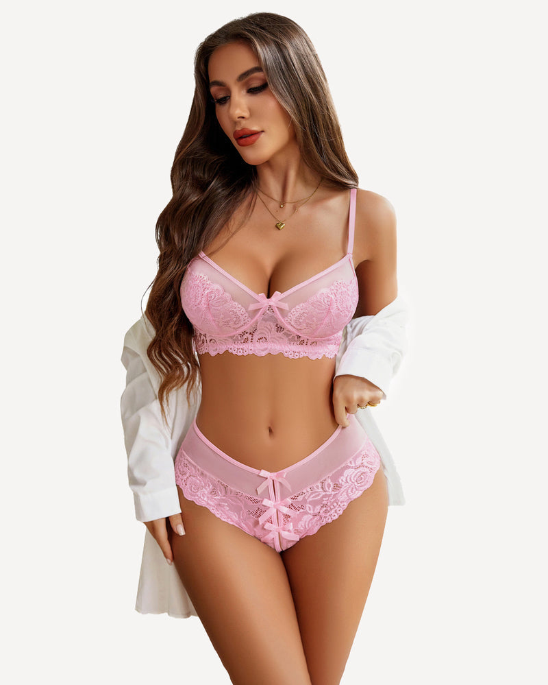 Pink lace bra and matching lace panty set with underwire cups and bow accents.