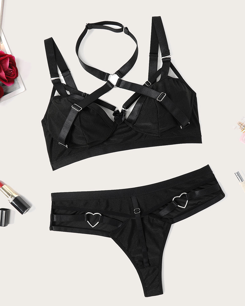 Black push-up bra and thong set with strappy cutouts and heart accents