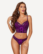Purple lace bra and matching panty set with corset-style front lacing and scalloped trim