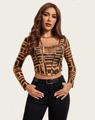 Sheer brown-and-black geometric print crop top with long sleeves and corset seams