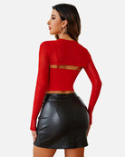 Red long-sleeve mesh crop top with open back and matching cami