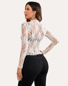 White sheer lace floral blouse back view with long sleeves and peplum hem